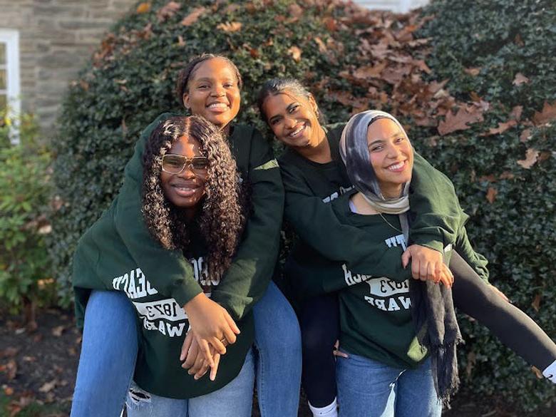 four students smiling at Penn State Abington (near Philadelphia)